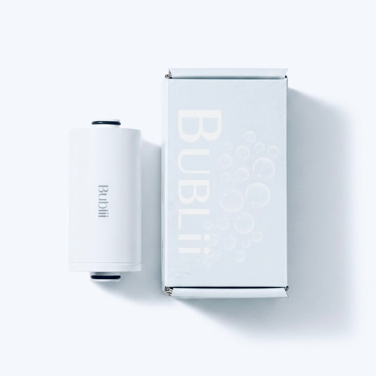 BUBLII Shower Filter Refill Cartridge. A white cylindrical bubble wand and its matching white packaging box, both featuring the brand name 'BUBLi', displayed on a clean white background with soft shadows.