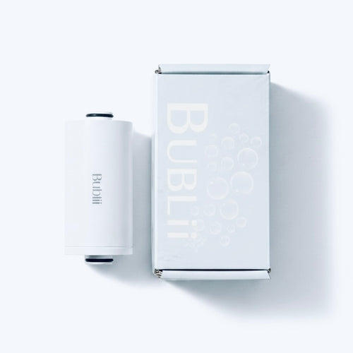 BUBLII Shower Filter Refill Cartridge. A white cylindrical bubble wand and its matching white packaging box, both featuring the brand name 'BUBLi', displayed on a clean white background with soft shadows.